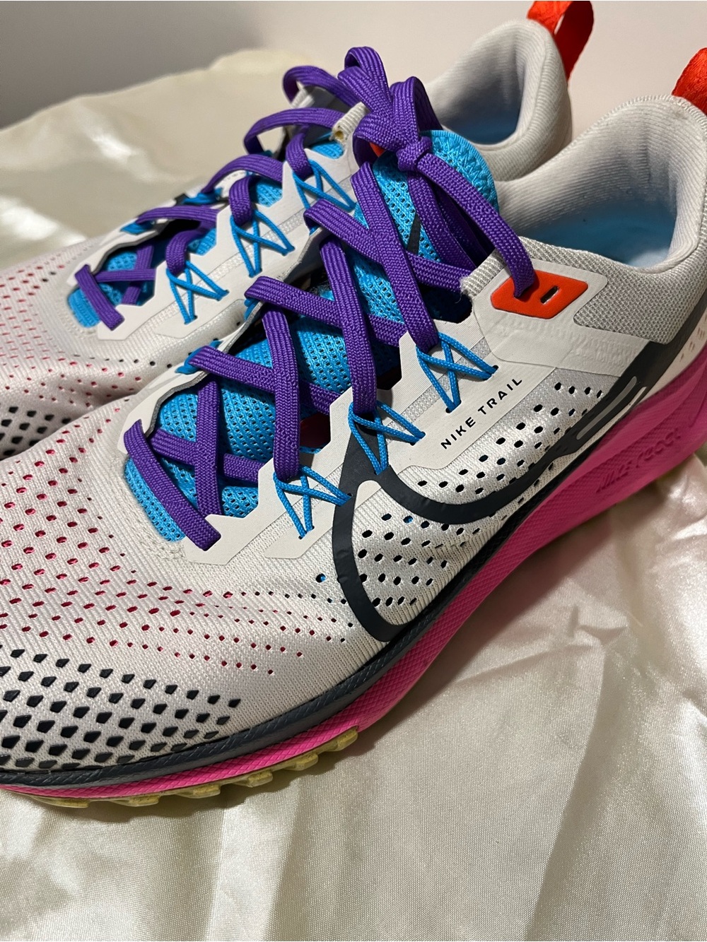 Nike Women's White Trail Running Shoes with Purple, Blue and Pink Accents